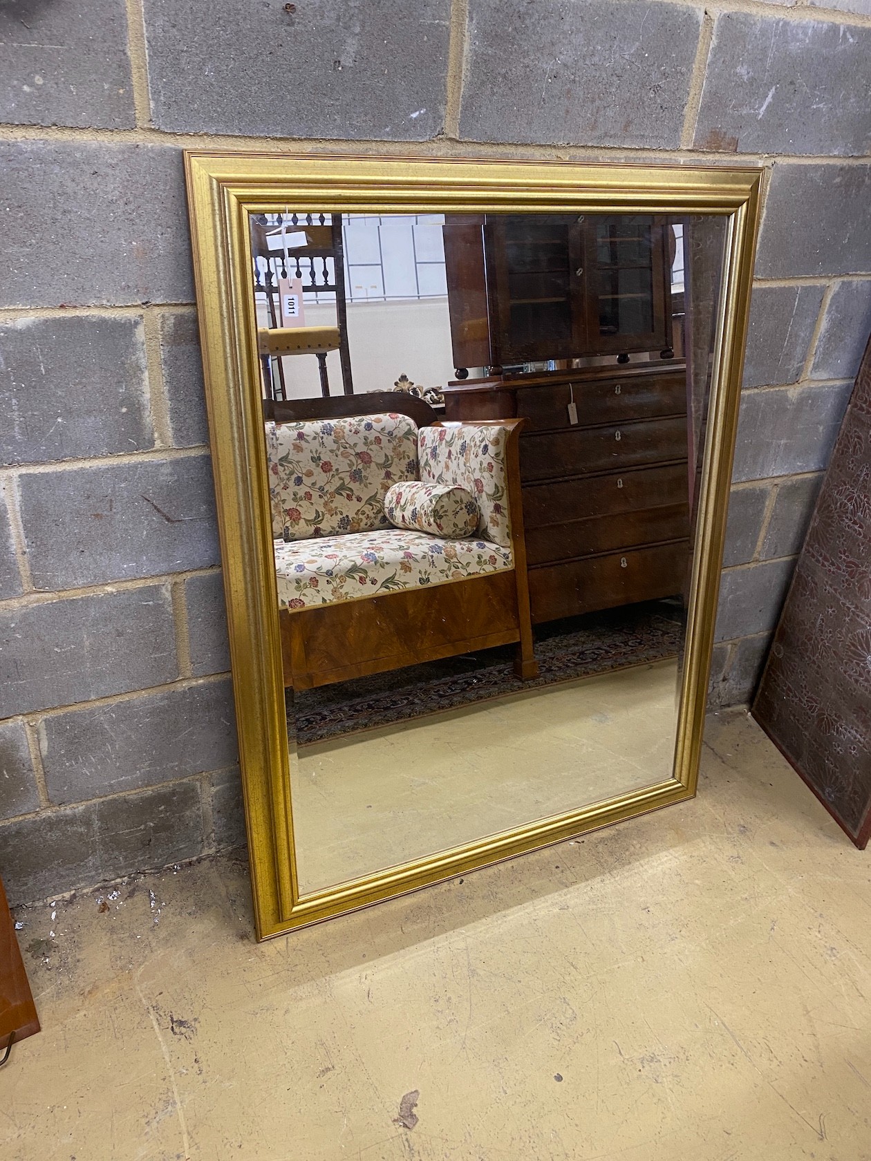 A reproduction rectangular gilt framed wall mirror, width 106cm, height 138cm
